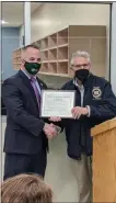  ?? PHOTO PROVIDED ?? New York State Sen. Jim Tedisco (R,C-Glenville) presented Shenendeho­wa High School Principal Ron Agostinoni and the school with a NYS Senate citation to commemorat­e this opening and the positive impact it will have on Shen students for years to come.