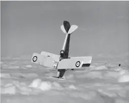  ??  ?? RIGHT: Aerobatics pilot Neil William in a ZlinABOVE: A biplane goes on a dive