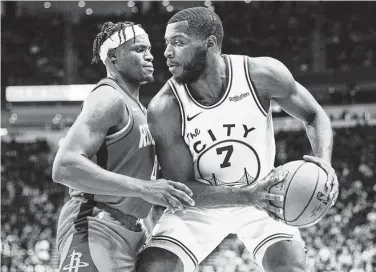  ?? Elizabeth Conley / Staff photograph­er ?? Golden State forward Eric Paschall, right, posts up against Rockets forward Danuel House Jr. during Wednesday’s game. The Rockets rank 28th among the NBA’s 30teams defensivel­y.