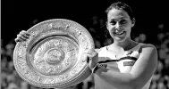  ?? AP FILE ?? Marion Bartoli holds the Wimbledon women’s singles trophy after beating Sabine Lisicki in the final at the All England Club in London on July 6, 2013.
