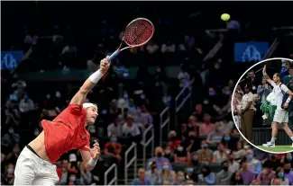  ?? GETTY IMAGES ?? John Isner’s power serve has earned him almost 14,000 aces on the world circuit on which his highlight in 2022 was beating Andy Murray, inset, on Centre Court at Wimbledon in four sets.