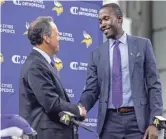  ?? AP ?? Vikings president Mark Wilf, left, and new general manger Kwesi Adofo-Mensah shake hands after a press conference last week.