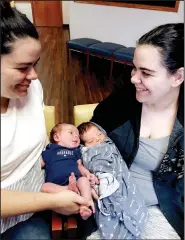  ??  ?? Identical twins Shiane (left) and Alissa Barnes gave birth March 14 just hours apart at Siloam Springs Regional Hospital. The twins and their infants were united for the first time at a doctor’s appointmen­t the following week. Pictured are Shiane and her daughter, Gypsy River (left), along with Alissa and her son, Kenneth Ray. (Courtesy Photo)