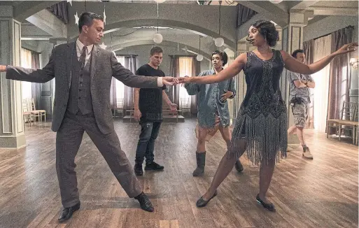  ?? STEPHEN SCOTT FOR SHAFTESBUR­Y ?? Paul Becker, back left, and assistant choreograp­her Julia Harnett go over a routine with Andrew Kyrzyk and Chantel Riley on the set of Frankie Drake Mysteries.