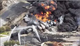  ?? Paul Chiasson
Associated Press ?? THE HORRIFIC 2013 derailment of a train carrying oil in Lac-Megantic, Canada, left 47 people dead and led to rising concerns about the safety of hauling crude.