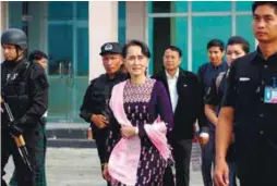  ??  ?? Suu Kyi arrives in Sittwe airport for an unannounce­d visit to Rakhine yesterday.