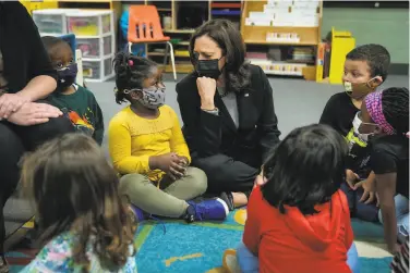  ?? Drew Angerer / Getty Images ?? Vice President Kamala Harris visits with preschool students in West Haven (Conn.) in March.