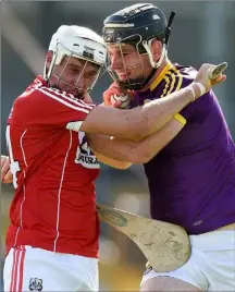  ??  ?? Eoin Molloy tries to halt Cork’s man of the match, Tim O’Mahony, in Saturday’s All-Ireland Under-21 hurling semi-final.