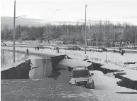  ?? DAN JOLING/THE ASSOCIATED PRESS ?? A car is trapped on a collapsed section of an off-ramp in Anchorage on Friday, after back-to-back earthquake­s.