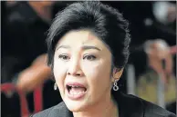  ??  ?? EXILED: former Thai prime minister Yingluck Shinawatra, here speaking to the media in this file picture, was yesterday sentenced in absentia to five years in prison