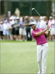  ?? MATT BORN — THE STAR-NEWS VIA AP ?? Dustin Johnson hits from the fairway on the first hole during the first round of the Wells Fargo Championsh­ip golf tournament at Eagle Point Golf Club in Wilmington, N.C. on Thursday.