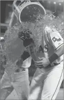  ??  ?? Rangers shortstop Elvis Andrus dunks Joey Gallo with Gatorade after the game. Playing on the same side of the infield at third base, Gallo didn’t have to make a play in the field the entire game.