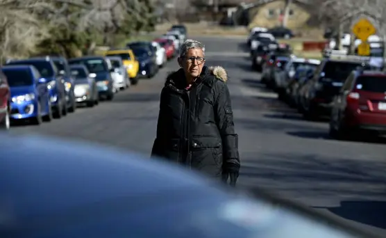  ?? Eric Lutzens, The Denver Post ?? Lenore Herskovitz stands on South Cody Court in Lakewood. Colorado Christian University has been housing its students in properties it owns on the street. “The congestion from cars is unbelievab­le — it’s not a normal residentia­l street anymore,” said Herskovitz.