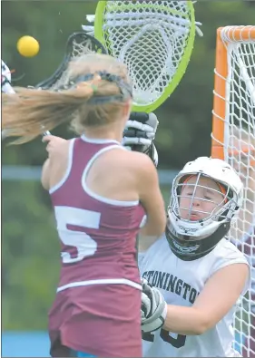  ?? TIM COOK/THE DAY ?? Stonington goalie Lexi Bucko reaches up to deflect a shot by Granby’s Olivia Johnson during the Bears’ 13-10 win in Saturday’s Class S championsh­ip game.