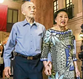  ??  ?? Oscar M. Lopez and his wife, Connie, walk hand in hand into Kidzania.