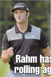  ?? STAFF PHOTO BY CHRIS CHRISTO ?? POWER PLAY: Jon Rahm reacts after his eagle on No. 18 yesterday at TPC Boston, the spark he needed in what became a 5-under 66.