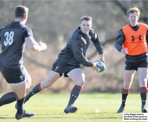  ??  ?? > Dan Biggar back in the thick of the action in Wales training this week