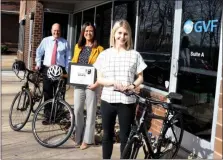  ?? SUBMITTED PHOTO ?? The League of American Bicyclists has awarded GVF with the Silver Level Bicycle Friendly Business award — one of 1,366 businesses across the country recognized for their efforts toward building a more bicycle friendly America. In this photo left to right with bikes GVF has on hand for employees are: Rob Henry, GVF executive director; Maureen Farrell, GVF deputy executive director; and Katie Borsuk, TDM coordinato­r.