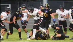  ?? File photo / Union Democrat ?? Summervill­e’s Nick Veach (8) crashes through the Ripon Christian defense for a gain on the play in September 2019.