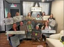  ?? SUBMITTED PHOTO ?? Employees of AR Workshop in New Hanover pose with some of their own creations. The staff recently held a training to prepare for the May 19 opening of the studio.