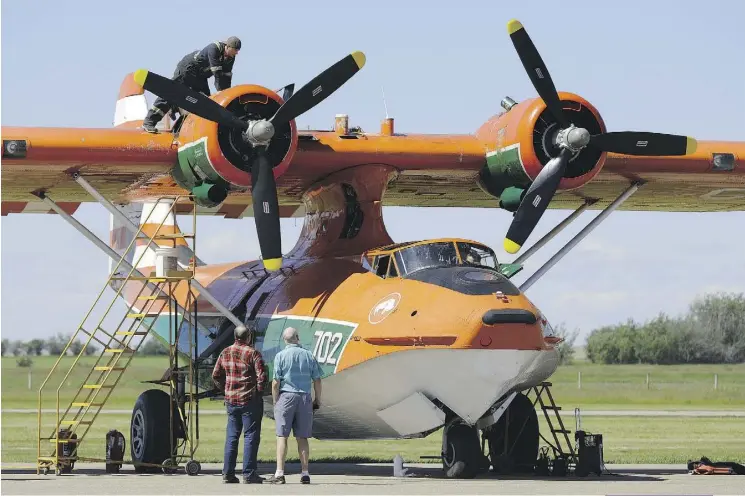  ?? LARRY WONG ?? A restored Canso PBY-5A C-FNJE aircraft, built in the 1940s, is prepared for its first official flight at the Fairview Municipal Airport at the Father’s Day Fly-In Breakfast. People who flew or worked on the historic Canadian aircraft were in attendance.