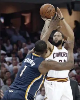  ?? ASSOCIATED PRESS FILE ?? Deron Williams shoots over the Pacers’ Kevin Seraphin in the first half in Game 2 of the Cavaliers’ first-sweep April 17 at Quicken Loans Arena.