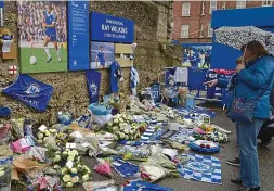 ?? GETTY IMAGES ?? Heartfelt: tributes to Wilkins at the Shed Wall