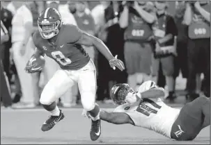  ?? The Associated Press ?? SWEET HOME ALABAMA: Alabama running back Josh Jacobs (8) slips past Louisville defensive lineman Michael Boykin (41) a week ago for a gain during the first half of the Crimson Tide’s 51-14 win in Orlando, Fla. Arkansas State travels to Tuscaloosa today for the first home game of the season for Alabama.