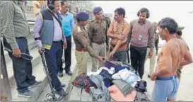  ?? HT PHOTO ?? Antisabota­ge squad frisking pilgrims at Saryu Ghat in Ayodhya on Tuesday.