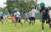  ?? WELLS DUSENBURY/STAFF PHOTO ?? Atlantic players go through drills on the second day of fall football practice on Tuesday.