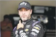  ?? Terry Renna / Associated Press ?? Jimmie Johnson leaves his garage after NASCAR auto racing practice at Daytona Internatio­nal Speedway on Feb. 16 in Daytona Beach, Fla.