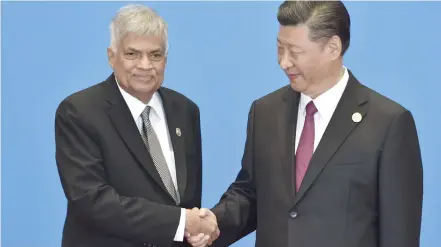  ?? Photo: New Indian Express ?? Sri Lankan Prime Minister Ranil Wickremesi­nghe shakes hands with Chinese President Xi Jinping during the Belt and Road Forum for Internatio­nal Co-operation.