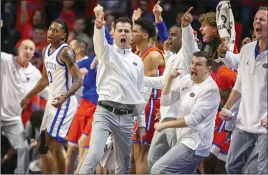  ?? (AP/Alan Youngblood) ?? Florida Coach Todd Golden celebrates as Kentucky guard Rob Dillingham (0) goes out of bounds during a game on Jan. 6 in Gainesvill­e, Fla.