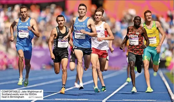  ?? GETTY IMAGES ?? COMFORTABL­E: Jake Wightman of Scotland easily won his 1500m heat in Birmingham