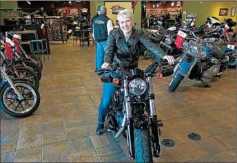  ?? IVAN MORENO/AP ?? Samantha Kay, 25, of Milwaukee, took a course at a dealership as part of Harley-Davidson’s “Riding Academy.”