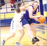  ?? Westside Eagle Observer/MIKE ECKELS ?? Jazman Herrera (left) tries to force Hailey Cunningham (right) into a trap along the sideline during the second quarter of the Decatur-Cotter varsity girls’ game in Decatur Friday night. Herrera forced Cunningham to lose control of the ball, out of bounds, with the possession going to the Lady Bulldogs.