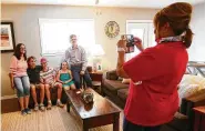  ??  ?? Judy, from left, Camden, Kovan, Jaylee and Bryston Ferguson pose for a photo in their new home.