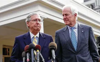  ?? Alex Brandon / Houston Chronicle ?? Senate Majority Leader Mitch McConnell and Senate Majority Whip John Cornyn speak with reporters Tuesday after meeting with President Trump. McConnell said if Republican­s cannot come to an agreement, they will be forced to negotiate with Democratic...