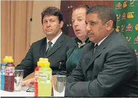  ?? /Gallo Images ?? Top coaches: Jake White, centre, with assistant coaches Gert Smal, left, and Allister Coetzee face the media in Perth in 2004.