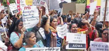  ?? Associated Press ?? ↑ Women activists shout slogans during a protest in New Delhi, recently.