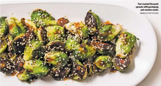  ?? AMERICA’S TEST KITCHEN ?? Pan-roasted Brussels sprouts with gochujang
and sesame seeds.