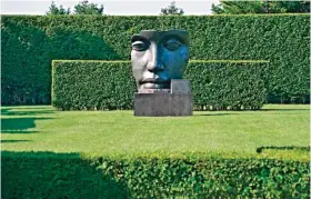  ??  ?? This undated photo provided by The Monacelli Press shows "Per Adriano" by sculptor Igor Mitoraj in a residentia­l garden on the east end of Long Island in New York. — AP photos