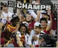  ?? JAY BIGGERSTAF­F — GETTY IMAGES ?? The Iowa State Cyclones celebrate after beating Houston in the Big 12 Tournament championsh­ip game.