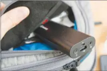  ?? MICHAEL HESSION / WIRECUTTER ?? Instead of buying “smart luggage,” a few simple upgrades — such as this Jackery Bolt portable USB battery pack — will make your favorite carry-on smart enough to charge your gadgets, weigh itself, and warn you if you’ve forgotten it.