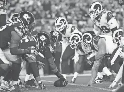  ?? AP FILE ?? The Steelers’ offense, left, lines up against the Rams’ defense during a 2019 game in Pittsburgh. The NFL’s decision to expand the playoffs from 12 to 14 teams this season could have a major impact on the league based on how things have played out in the past.