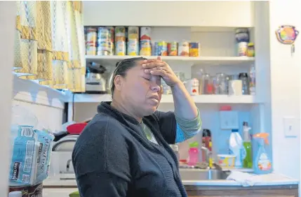  ??  ?? After cooking their one meal for the day of beans, egg and handmade tortillas, Janeth worries, “Where can we get enough food?,” while in her kitchen April 15 in Washington.