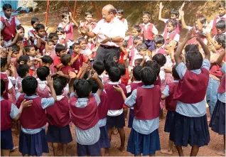  ??  ?? SHOW OF HANDS Jose Maveli with children from one of his orphanages