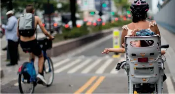  ?? (Justin Gilliland/The New York Times) ?? Cyclists on the West Side Highway in New York.