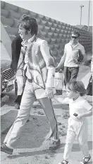  ?? AP ?? Julian Lennon with his father, John, at London’s Heathrow airport in 1967.