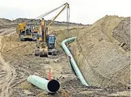  ?? AP ?? Heavy equipment is seen at a site where sections of the Dakota Access pipeline were being buried near the town of St Anthony in Morton County, North Dakota.